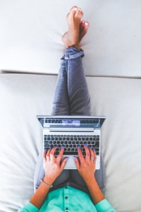 hands-woman-legs-laptop-medium